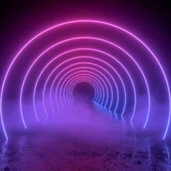 A series of luminous, pink, and Lilac Diesel #22 Multipack (F) concentric arches create a glowing tunnel effect against a dark background with fog at the base.